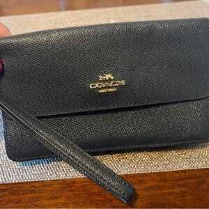Coach gently used wristlet wallet.  Navy blue.